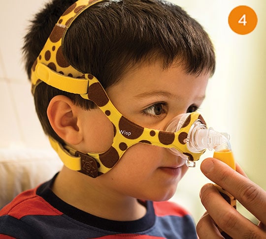 kid wearing sleep apnea mask