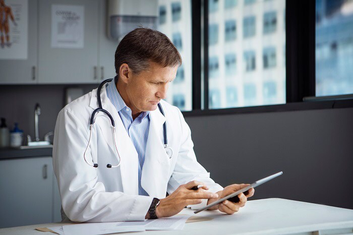 Doctor using tablet