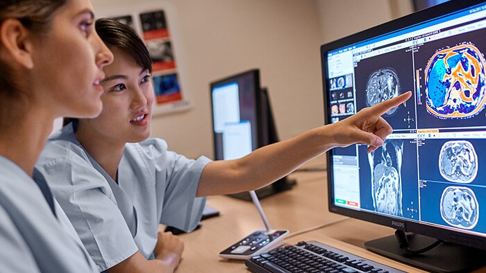 Two nurses looking at monitors